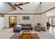 Comfortable living room with vaulted ceiling, hardwood floors, and view of dining room at 3711 Frey Lake Nw Rd, Kennesaw, GA 30144