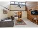 Open living room with high ceilings, wood accent wall, and ample seating at 3711 Frey Lake Nw Rd, Kennesaw, GA 30144