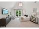 Bright bedroom features vaulted ceilings, a television, and French doors leading to a patio at 477 Michael Dr, Alpharetta, GA 30009