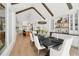 Dining room featuring beamed ceilings, a large window, and a view into the kitchen and other living areas at 477 Michael Dr, Alpharetta, GA 30009