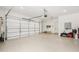 Spacious garage featuring epoxy flooring, ample storage space, and a clean, organized layout at 477 Michael Dr, Alpharetta, GA 30009