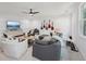 Stylish living room features a ceiling fan, mounted TV, and an array of decorative guitars at 477 Michael Dr, Alpharetta, GA 30009