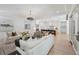 Bright, spacious living room with modern decor leading into open-concept kitchen at 477 Michael Dr, Alpharetta, GA 30009