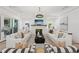Bright living room with modern fireplace, comfortable seating, and access to outdoor living space at 477 Michael Dr, Alpharetta, GA 30009