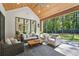Inviting outdoor space includes comfortable seating, manicured yard, and outdoor access at 477 Michael Dr, Alpharetta, GA 30009