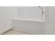 Clean shower with white tiled walls and a shower head at 477 Michael Dr, Alpharetta, GA 30009