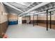 Unfinished basement featuring exposed pipes, wood paneling, and potential for customization and storage space at 60 Ivy Dr, Covington, GA 30016