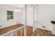 Formal dining room with hardwood floors, white wainscoting and ample natural light at 60 Ivy Dr, Covington, GA 30016