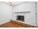 Close up of a whitewashed stone fireplace with stone accents at 60 Ivy Dr, Covington, GA 30016