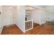 Inviting foyer with hardwood floors, a white fireplace, and entry to the main level at 60 Ivy Dr, Covington, GA 30016
