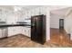 Modern kitchen with stainless appliances and an opening to the living room at 60 Ivy Dr, Covington, GA 30016