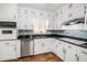 Kitchen featuring updated appliances, granite countertops, and cabinetry at 60 Ivy Dr, Covington, GA 30016