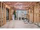 Unfinished basement space framed and insulated with weight lifting equipment and Christmas decorations at 915 Pebble Creek Trl, Suwanee, GA 30024