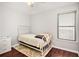 Bright bedroom with hardwood floors, ceiling fan and a sunny window perfect for relaxing or sleeping at 915 Pebble Creek Trl, Suwanee, GA 30024
