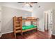 Bedroom with vaulted ceiling, hardwood floors, and bunkbeds at 915 Pebble Creek Trl, Suwanee, GA 30024