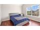 Bedroom with hardwood floors and many windows at 915 Pebble Creek Trl, Suwanee, GA 30024