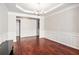 Formal dining area showcasing detailed trim work, hardwood floors, and modern lighting at 915 Pebble Creek Trl, Suwanee, GA 30024