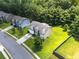 An aerial side view shows the manicured lawn of this home at 1492 Station Ridge Ct, Lawrenceville, GA 30045