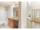 Bathroom featuring vanity with granite countertops and a view to the living area at 1492 Station Ridge Ct, Lawrenceville, GA 30045