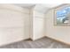 Walk-in closet with ample shelving and natural light from a window at 1492 Station Ridge Ct, Lawrenceville, GA 30045