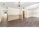 Open-concept living area featuring luxury vinyl plank flooring and entry to second floor at 1492 Station Ridge Ct, Lawrenceville, GA 30045