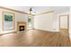 Living room features a cozy fireplace and a view into the connecting room at 1492 Station Ridge Ct, Lawrenceville, GA 30045