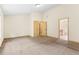 A main bedroom offers plenty of space, soft carpet, and doors leading to the bathroom at 1492 Station Ridge Ct, Lawrenceville, GA 30045