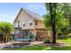 Backyard features a wooden deck, lawn, mature trees, trampoline and playset at 2102 Berryhill Se Cir, Smyrna, GA 30082