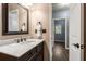 Elegant bathroom with dark wood vanity, marble countertop, and bronze fixtures at 2102 Berryhill Se Cir, Smyrna, GA 30082