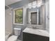 Bathroom featuring a modern vanity, brushed nickel fixtures, and a framed mirror at 2102 Berryhill Se Cir, Smyrna, GA 30082