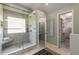 Modern bathroom featuring glass shower with built in bench and a walk-in closet at 2102 Berryhill Se Cir, Smyrna, GA 30082