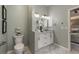 Bathroom featuring double sink vanity, gray marble tiled floors, and soft green walls at 2102 Berryhill Se Cir, Smyrna, GA 30082