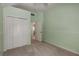 Bedroom with neutral carpet, light green walls, and a double door closet for ample storage at 2102 Berryhill Se Cir, Smyrna, GA 30082