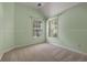 Bedroom featuring a neutral carpet, light green walls, and a double window at 2102 Berryhill Se Cir, Smyrna, GA 30082