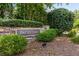 Stone sign identifying the Paces Lake community, nestled among manicured bushes and greenery at 2102 Berryhill Se Cir, Smyrna, GA 30082