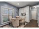Cozy dining area with natural light, luxury vinyl plank flooring, and stylish decor at 2102 Berryhill Se Cir, Smyrna, GA 30082