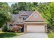 Charming two-story home with stone accents, manicured lawn, and attached two-car garage at 2102 Berryhill Se Cir, Smyrna, GA 30082