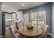 Bright eat-in kitchen featuring updated appliances, luxury vinyl plank flooring, and natural light at 2102 Berryhill Se Cir, Smyrna, GA 30082