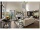 Elegant living room with tall ceilings, fireplace, large windows, and open layout to dining area at 2102 Berryhill Se Cir, Smyrna, GA 30082