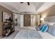 Comfortable main bedroom showcasing tray ceiling and doors to bathroom and bonus room at 2102 Berryhill Se Cir, Smyrna, GA 30082