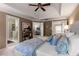 Main bedroom with tray ceilings, neutral colors, and doors to bathroom and bonus room at 2102 Berryhill Se Cir, Smyrna, GA 30082
