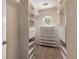 Spacious walk-in closet with built-in shelving and circular window at 2102 Berryhill Se Cir, Smyrna, GA 30082