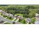 Aerial view of a neighborhood featuring well-maintained homes with lush green lawns near a dense forest backdrop at 2619 Dayview Ln, Atlanta, GA 30331