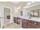 Bathroom with double vanity, marble countertops, and separate glass-enclosed shower at 2619 Dayview Ln, Atlanta, GA 30331