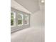 Bright bedroom with neutral carpet and multiple windows letting in natural light and neighborhood views at 2619 Dayview Ln, Atlanta, GA 30331