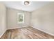 Bedroom with natural light from the window and updated flooring at 2619 Dayview Ln, Atlanta, GA 30331