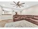Living room with hardwood floors, large sectional sofa, and access to other living spaces at 2619 Dayview Ln, Atlanta, GA 30331