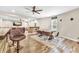 Spacious living area features a bar, dining area, media, ceiling fan, and light hardwood floors at 2619 Dayview Ln, Atlanta, GA 30331