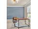 Simple office with a large desk and an overhead light at 2619 Dayview Ln, Atlanta, GA 30331