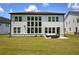 Spacious backyard with ample windows and a cozy seating area at 841 Keystone Dr, Woodstock, GA 30188